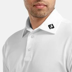 FootJoy Stretch Pique Solid Golf Polo Shirt 12 FootJoy Stretch Pique Solid Golf Polo Shirt -Golf Shirts Sales FOOTJOY 91823 FJ PERF SS SHIRT ATH WHITE Model 2